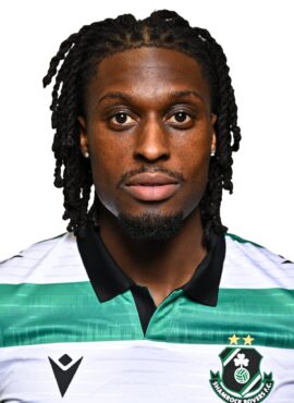 Shamrock Rovers football player in team jersey, close-up portrait.