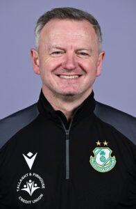 James O'Callaghan smiling in Shamrock Rovers team jacket, football coach.