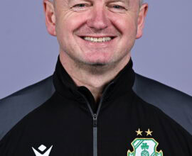 James O'Callaghan smiling in Shamrock Rovers team jacket, football coach.