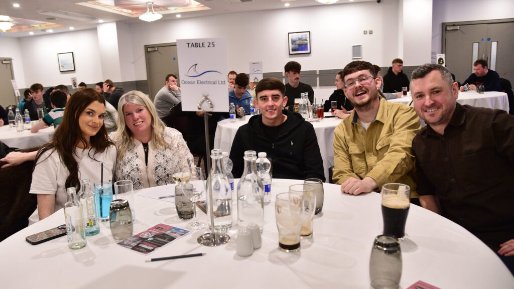 Celtic football fans enjoying social event at Shamrock Rovers stadium, Dublin, Ireland.