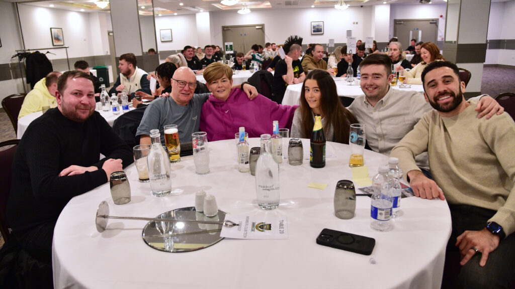1. Friends enjoying a team dinner at Shamrock Rovers event in Dublin.