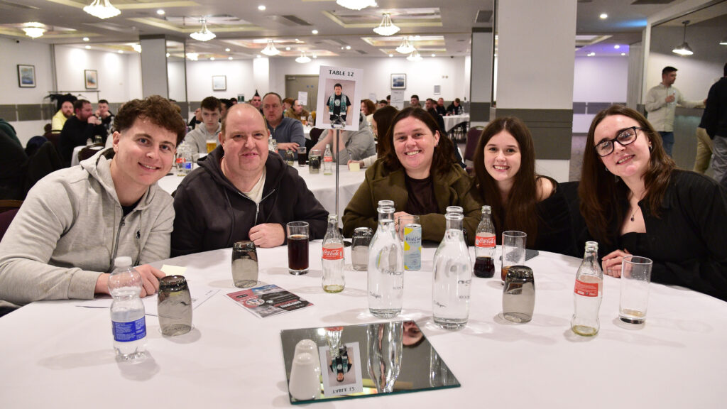 1. Friendly fans enjoying Shamrock Rovers match day at a social event in Dublin.