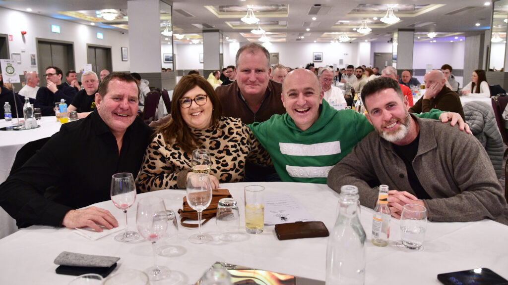 Celebration of Shamrock Rovers fans at dinner event, showcasing club pride and community spirit.