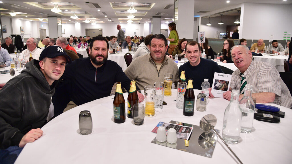 Enjoying a night out with Shamrock Rovers supporters at a club event. Celebrating football and team spirit in an indoor venue.