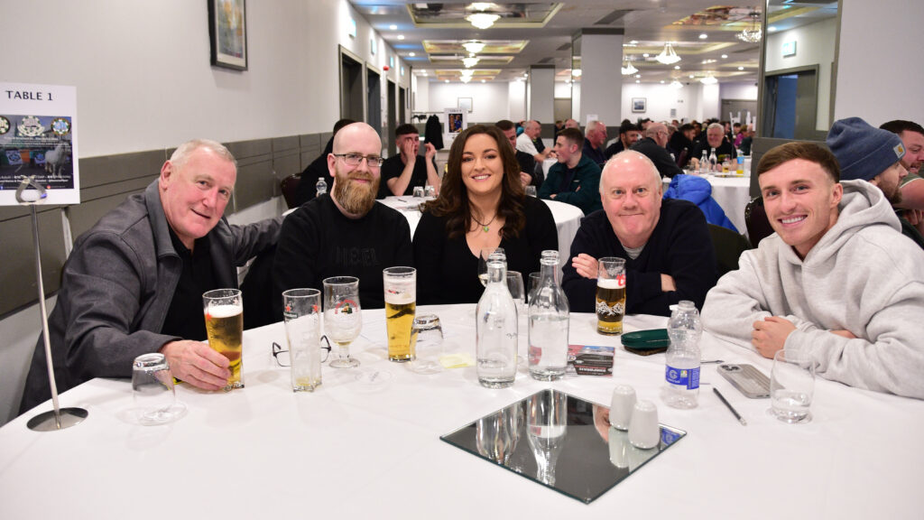 Cheerful fans enjoying a matchday gathering at Shamrock Rovers, Ireland's leading football club.