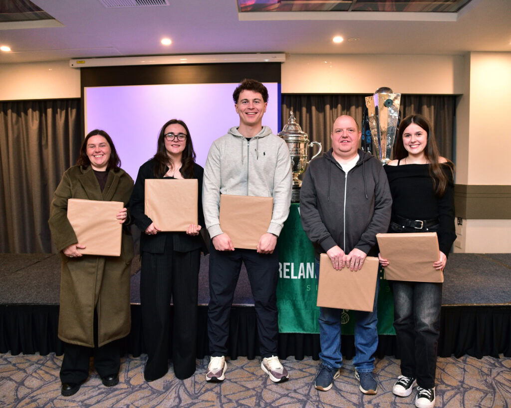 Award ceremony celebrating Shamrock Rovers players and community members, showcasing Irish football success.