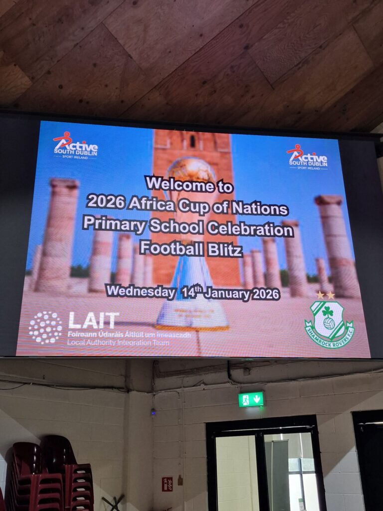 Shamrock Rovers football club promotional screen at Africa Cup of Nations celebration event.