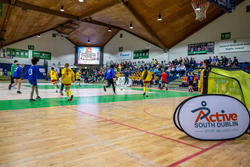 Kids playing indoor soccer at Shamrock Rovers sports venue in Dublin, Ireland.