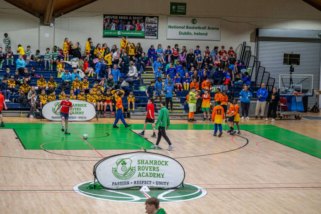 Youth football training session at Shamrock Rovers Academy indoor facility in Dublin, Ireland.
