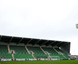 Shamrock Rovers stadium with green seats and floodlights, home of Irish football club.