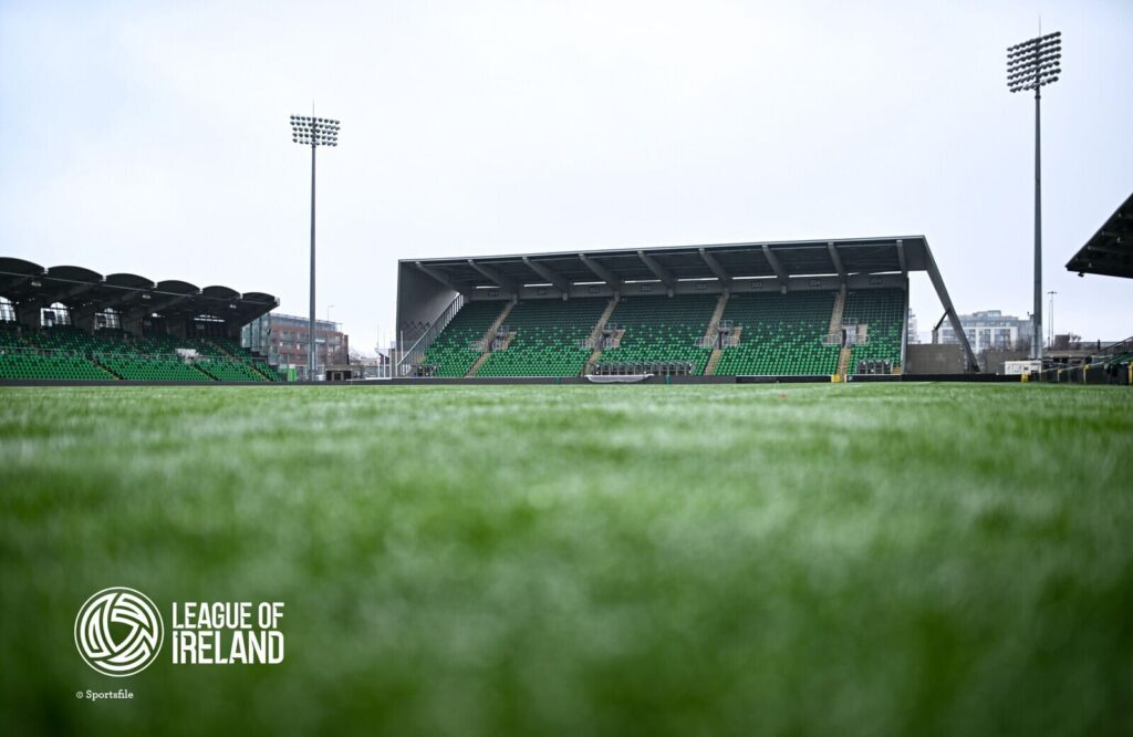 Shamrock Rovers stadium with green seats and floodlights in Dublin, Ireland.