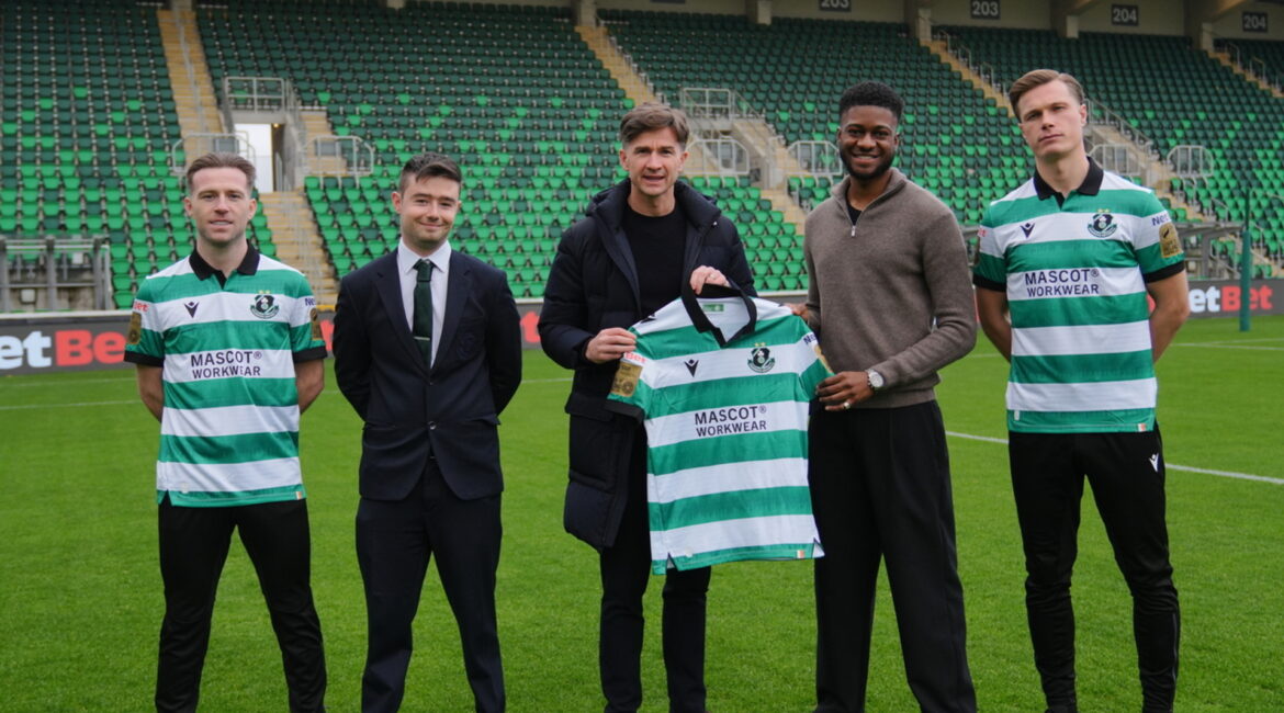 Shamrock Rovers players and officials on the pitch at Tallaght Stadium.