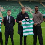 Shamrock Rovers players and officials on the pitch at Tallaght Stadium.