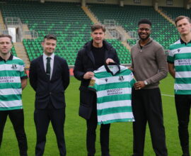 Shamrock Rovers players and officials on the pitch at Tallaght Stadium.