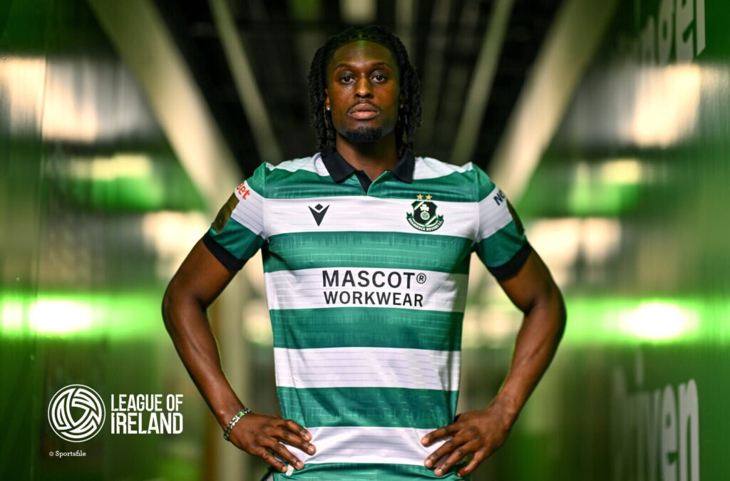 Shamrock Rovers player in green and white striped jersey in tunnel.