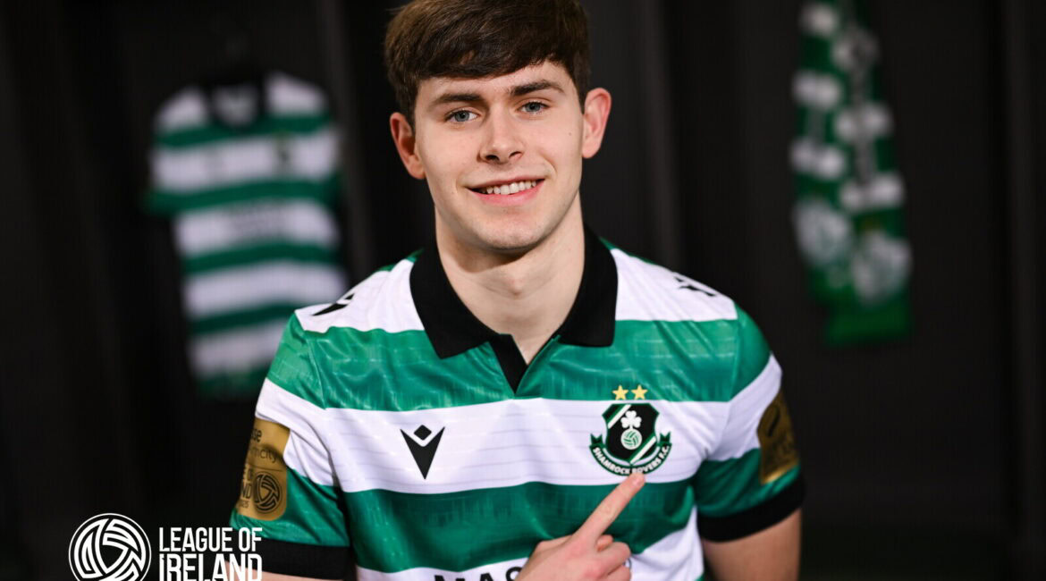 Young Shamrock Rovers player smiling in team jersey, League of Ireland.