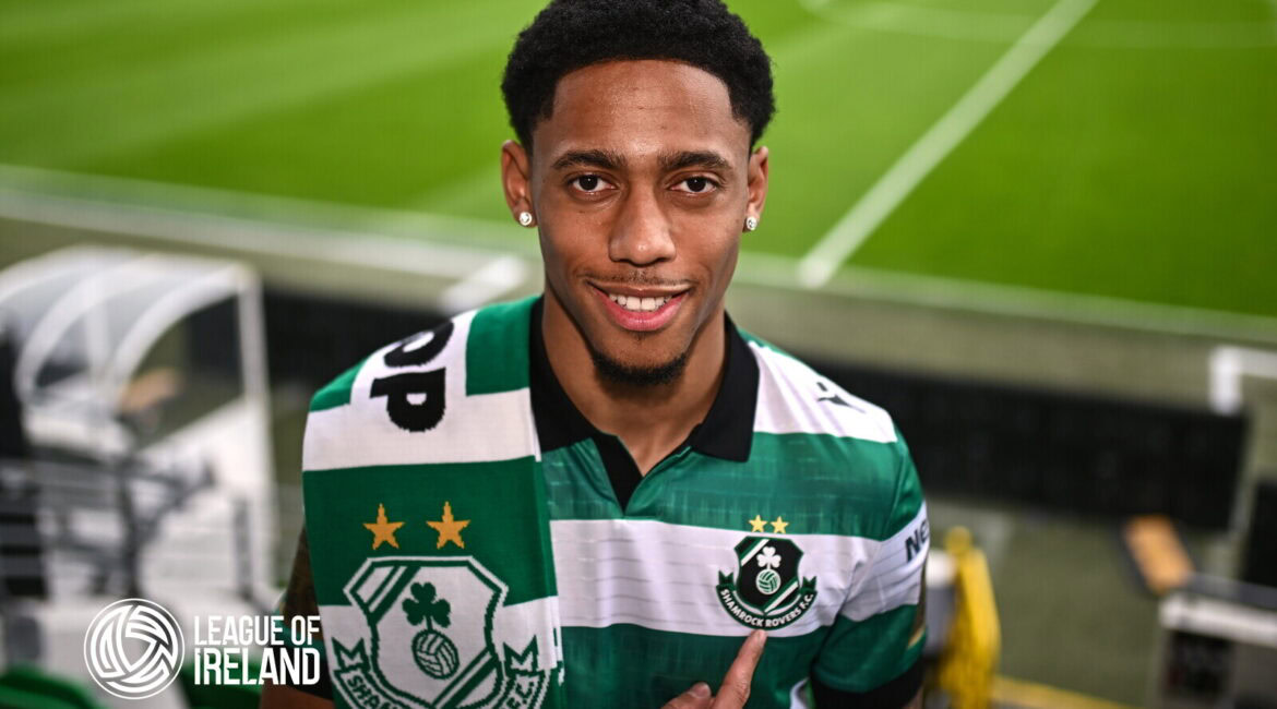 Shamrock Rovers player in green and white striped jersey at Tallaght Stadium.