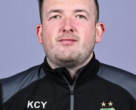 Close-up of Shamrock Rovers football player in team gear, facing camera.