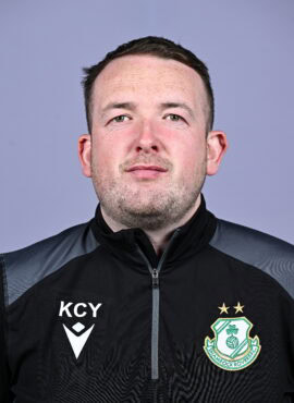 Close-up of Shamrock Rovers football player in team gear, facing camera.