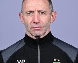 Shamrock Rovers coach in team jacket with club crest, facing camera against plain background.