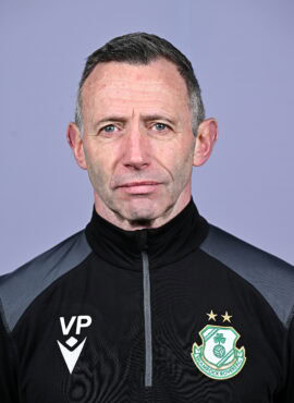 Shamrock Rovers coach in team jacket with club crest, facing camera against plain background.