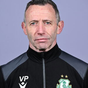 Shamrock Rovers coach in team jacket with club crest, facing camera against plain background.