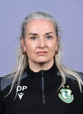 Female Shamrock Rovers player in team jersey, close-up portrait.