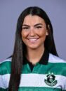 Female football player in Shamrock Rovers jersey smiling.