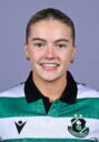 Shamrock Rovers female football player smiling in team jersey.