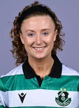 Shamrock Rovers female footballer smiling in team jersey.