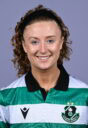 Shamrock Rovers female footballer smiling in team jersey.