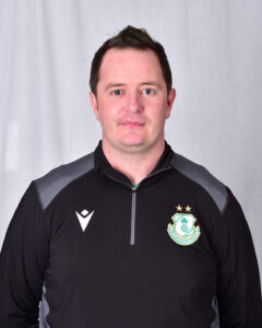 Dale Fitzsimons in Shamrock Rovers training kit, showcasing team logo and sportswear.