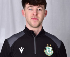 Young Shamrock Rovers football player in team kit with club crest.
