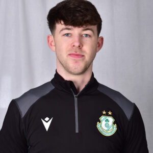 Young Shamrock Rovers football player in team kit with club crest.
