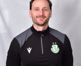 Portrait of Shamrock Rovers coach in team training gear.