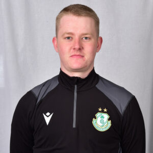 Young Shamrock Rovers player in team training jacket, facing forward.
