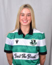 Female Shamrock Rovers player in green and white jersey smiling.