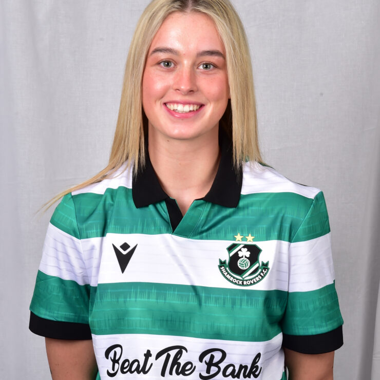 Female Shamrock Rovers player in green and white jersey smiling.