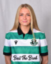 Female footballer in Shamrock Rovers jersey smiling at camera.