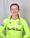Female footballer in Shamrock Rovers goalkeeper kit.