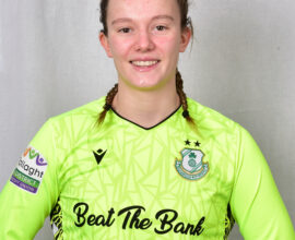 Female footballer in Shamrock Rovers goalkeeper kit.