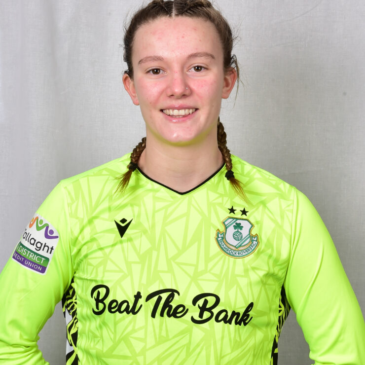 Female footballer in Shamrock Rovers goalkeeper kit.