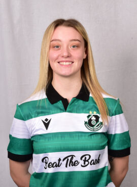 Female Shamrock Rovers player in green and white jersey smiling.