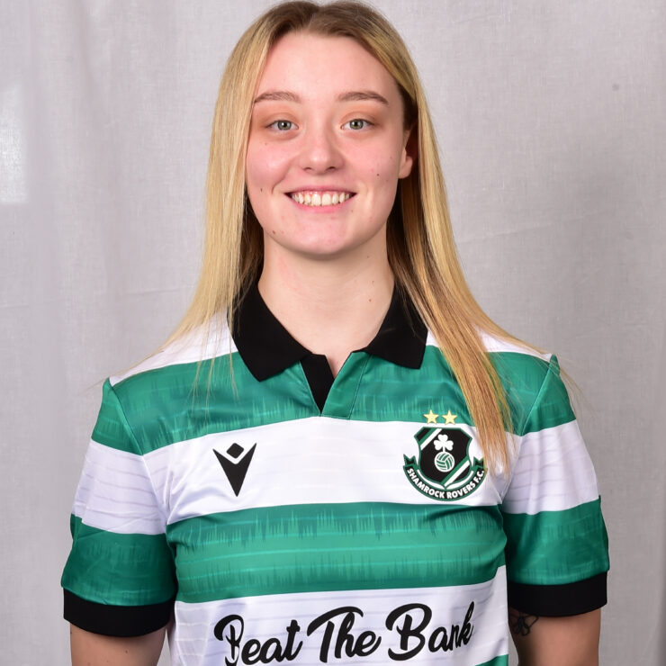 Female Shamrock Rovers player in green and white jersey smiling.