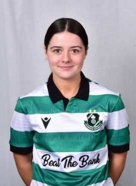 Female Shamrock Rovers player in green and white jersey, smiling.