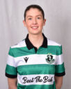Female Shamrock Rovers player in green and white jersey smiling.