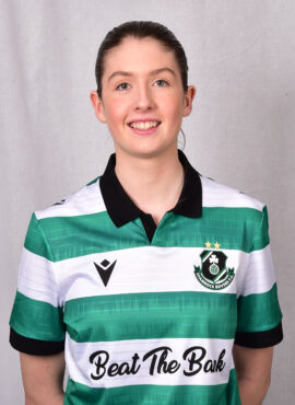 Female Shamrock Rovers player in green and white jersey smiling.
