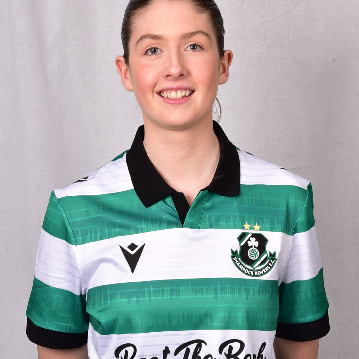 Female Shamrock Rovers player in green and white jersey smiling.