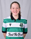 Female Shamrock Rovers player in green and white jersey smiling.