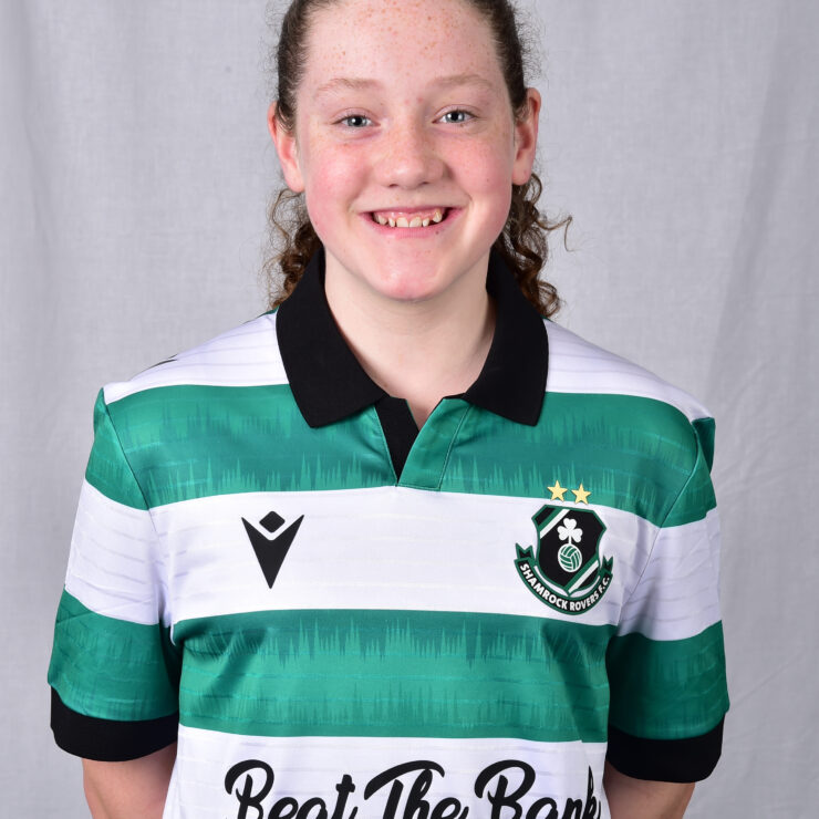 Female Shamrock Rovers player in green and white jersey smiling.